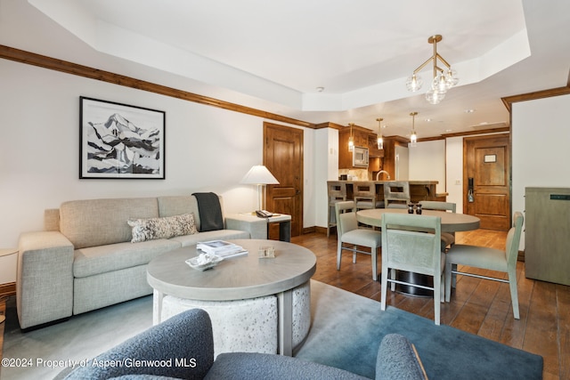 415 E Dean St Unit 32, Aspen, CO 81611 - living area with a tray ceiling, hardwood / wood-style flooring, and a chandelier