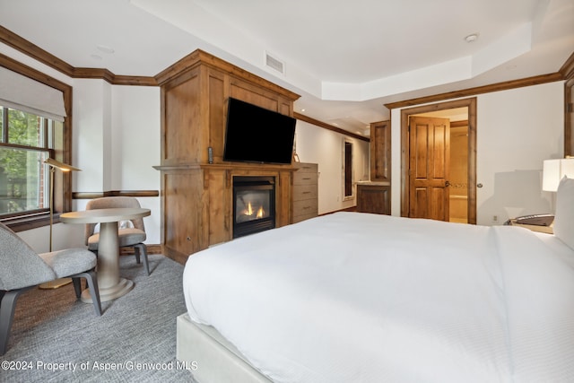 415 E Dean St Unit 32, Aspen, CO 81611 - bedroom featuring carpet floors, a glass covered fireplace, and crown molding