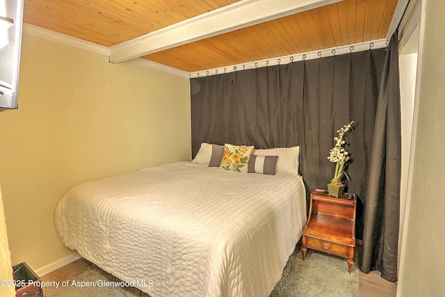 11101 County Road 117 Unit 3D, Glenwood Springs, CO 81601 - bedroom featuring wooden ceiling with exposed beams, wood finished floors, crown molding, and baseboards