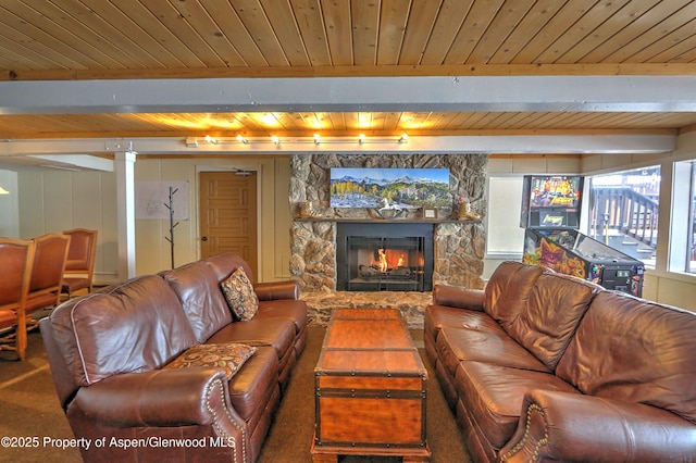 11101 County Road 117 Unit 3D, Glenwood Springs, CO 81601 - carpeted living room with wood ceiling with exposed beams and a fireplace