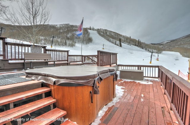 11101 County Road 117 Unit 3D, Glenwood Springs, CO 81601 - snow covered deck with a hot tub and a mountain view
