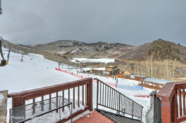 11101 County Road 117 Unit 3D, Glenwood Springs, CO 81601 - snow covered deck featuring a mountain view and a patio area