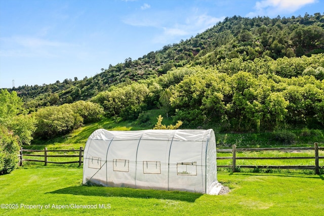 13 Laird Ln, Glenwood Springs, CO 81601 - view of greenhouse with a wooded view