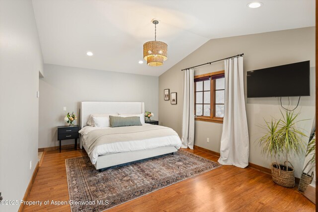 13 Laird Ln, Glenwood Springs, CO 81601 - bedroom with vaulted ceiling, light wood-type flooring, baseboards, and recessed lighting