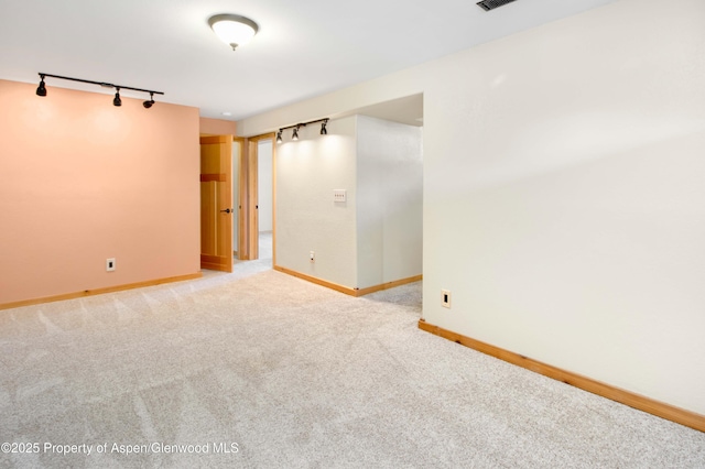 456 County Road 294, Rifle, CO 81650 - carpeted empty room featuring track lighting and baseboards