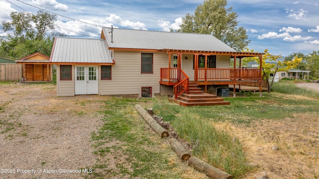 456 County Road 294, Rifle, CO 81650 - rear view of property featuring metal roof and a deck
