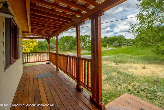 456 County Road 294, Rifle, CO 81650 - wooden terrace featuring a lawn and view of scattered trees