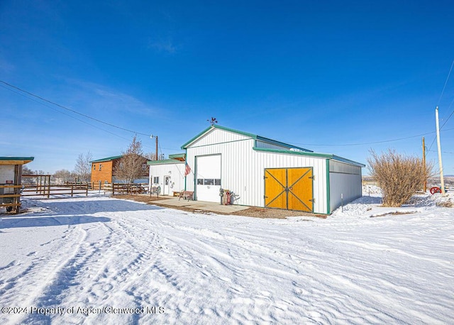 1020 Thompson Way, Craig, CO 81625 - snow covered structure with fence and an outbuilding