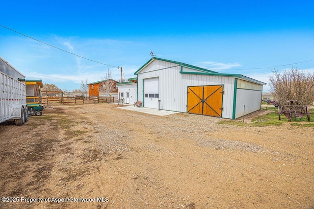 1020 Thompson Way, Craig, CO 81625 - view of outdoor structure featuring fence, an outdoor structure, and dirt driveway