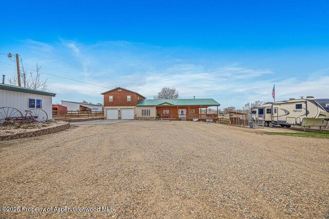 1020 Thompson Way, Craig, CO 81625 - view of front facade featuring an attached garage, fence, and driveway