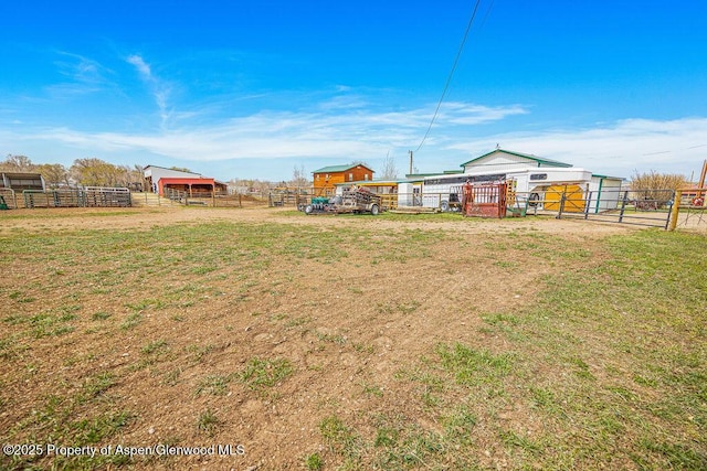 1020 Thompson Way, Craig, CO 81625 - view of yard featuring a gate, fence, and an outbuilding