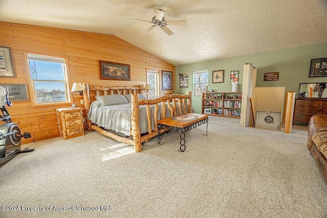 1020 Thompson Way, Craig, CO 81625 - bedroom with wooden walls, carpet flooring, multiple windows, and lofted ceiling