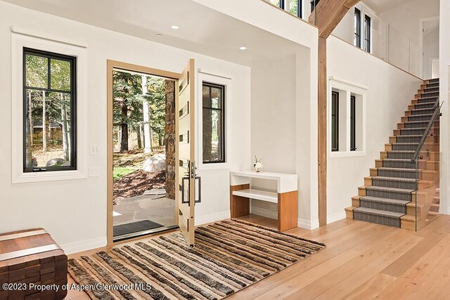 doorway with light wood-type flooring