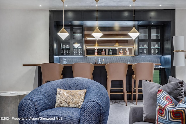 bar featuring hanging light fixtures