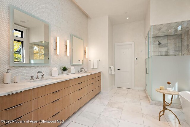 bathroom featuring vanity and an enclosed shower