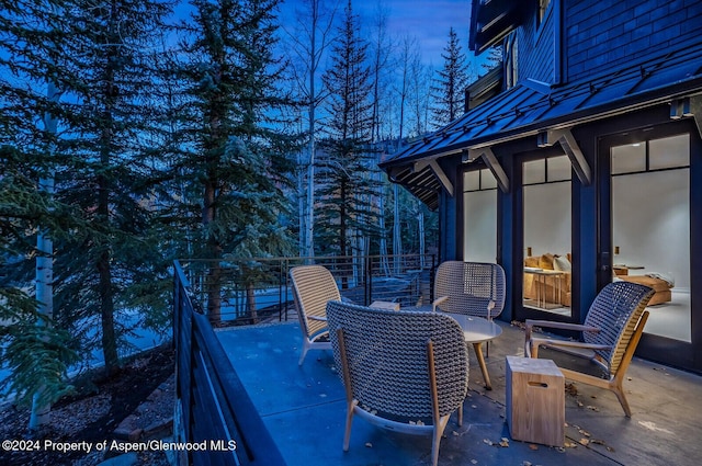 view of patio terrace at dusk