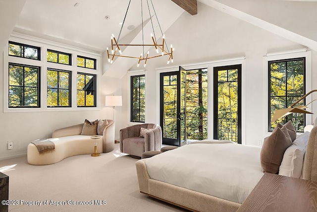 carpeted bedroom featuring vaulted ceiling with beams and an inviting chandelier