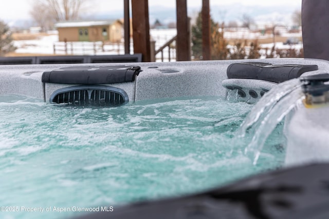 exterior details featuring a hot tub