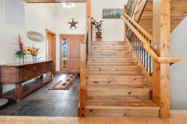 entryway with a towering ceiling