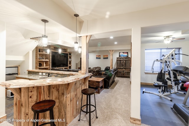 interior space featuring hanging light fixtures and ceiling fan