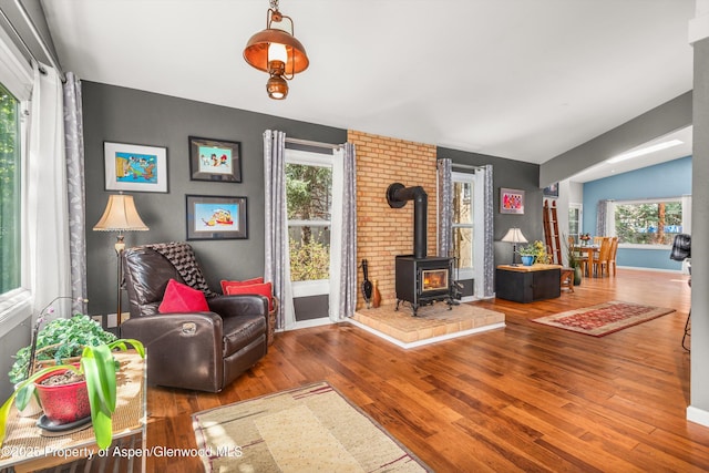 191 Navajo, Carbondale, CO 81623 - living room featuring wood finished floors, a wood stove, lofted ceiling, and baseboards