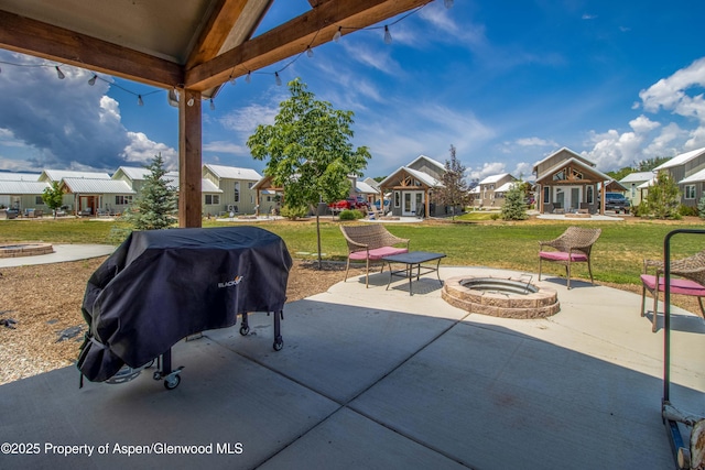 329 River Frontage Rd # 65, Silt, CO 81652 - view of patio featuring a residential view, a grill, french doors, and a fire pit
