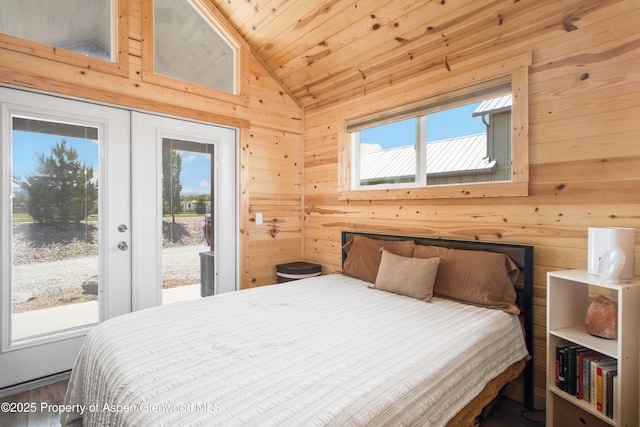 329 River Frontage Rd # 65, Silt, CO 81652 - bedroom with vaulted ceiling, access to exterior, wood walls, wooden ceiling, and french doors