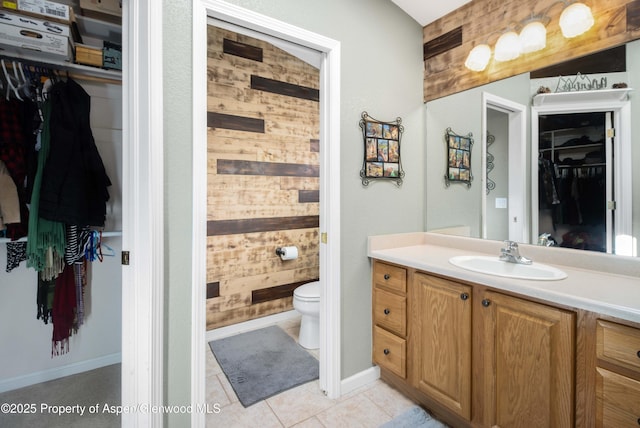 bathroom with vanity, tile patterned floors, and toilet