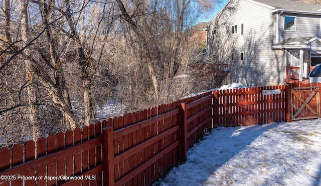 view of yard layered in snow