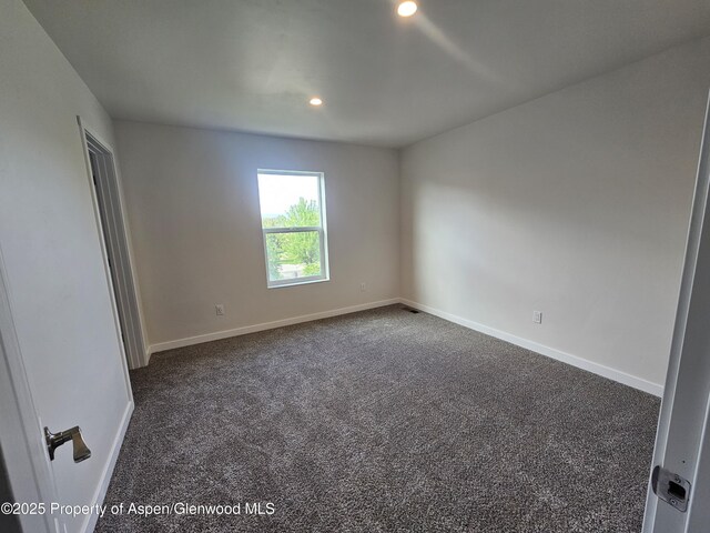 1720 Belgian Loop, Silt, CO 81652 - spare room featuring dark carpet and recessed lighting