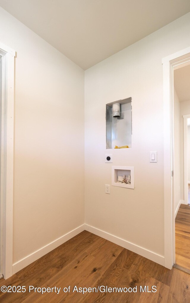 1720 Belgian Loop, Silt, CO 81652 - washroom featuring hookup for an electric dryer, washer hookup, and wood finished floors