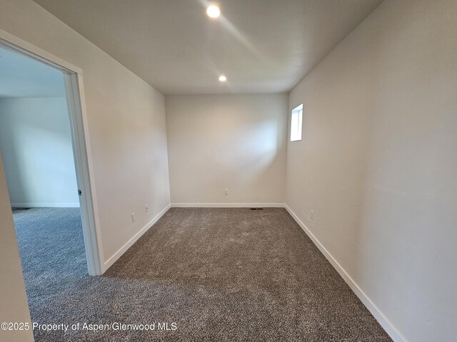 1720 Belgian Loop, Silt, CO 81652 - unfurnished room featuring dark colored carpet and recessed lighting