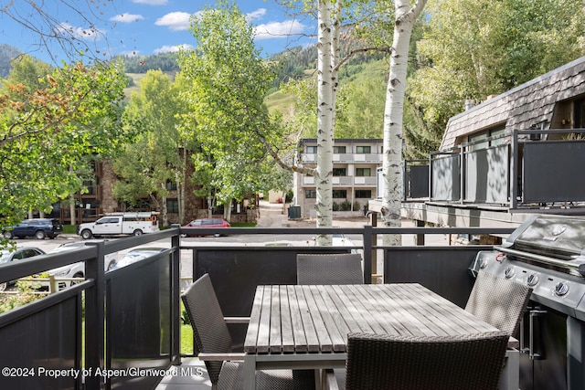 124 E Durant Ave Unit 6, Aspen, CO 81611 - wooden deck featuring outdoor dining area