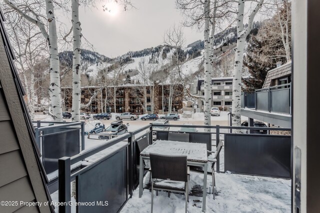 124 E Durant Ave Unit 6, Aspen, CO 81611 - snow covered patio featuring a mountain view and a balcony