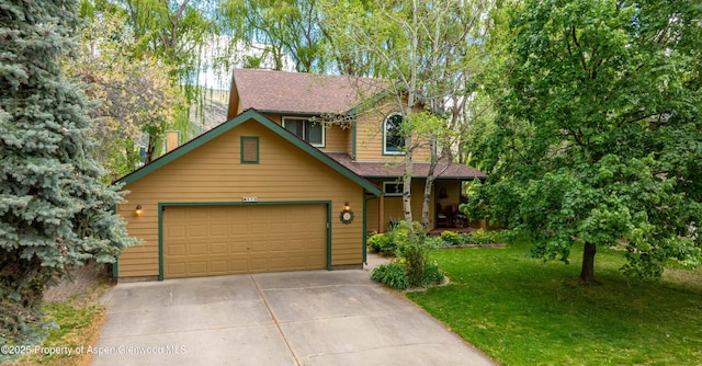 170 Deer Run, Carbondale, CO 81623 - rustic home with a front yard, concrete driveway, covered porch, roof with shingles, and a garage