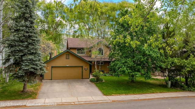 170 Deer Run, Carbondale, CO 81623 - view of front of property with concrete driveway, a front lawn, and an attached garage