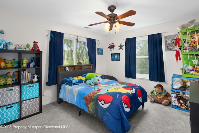 170 Deer Run, Carbondale, CO 81623 - bedroom with carpet flooring, multiple windows, and ceiling fan
