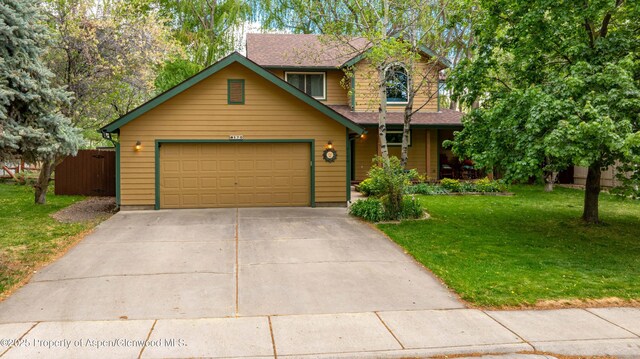 170 Deer Run, Carbondale, CO 81623 - view of front facade with concrete driveway and a garage