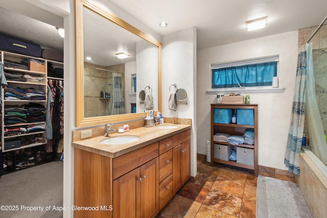 170 Deer Run, Carbondale, CO 81623 - full bathroom featuring a walk in closet and double vanity