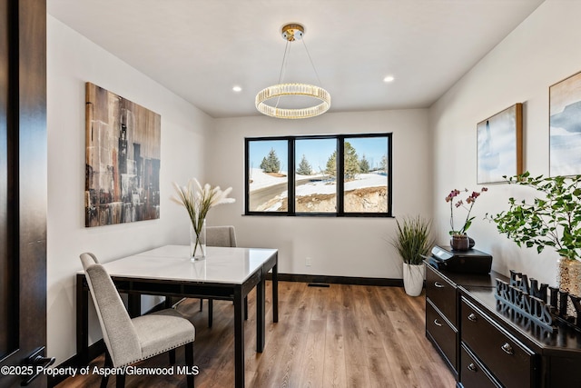 dining space featuring light wood-type flooring