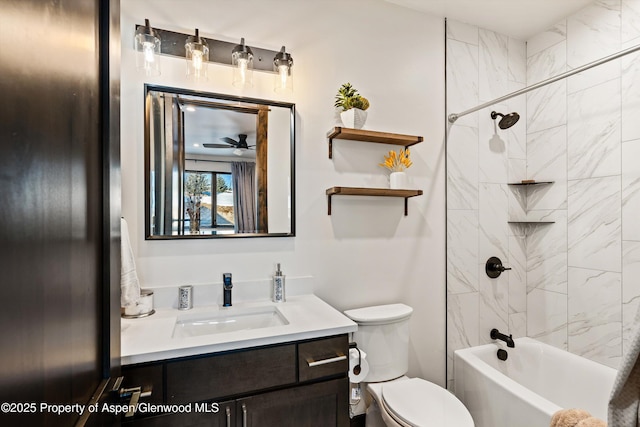 full bathroom featuring vanity, toilet, and tiled shower / bath