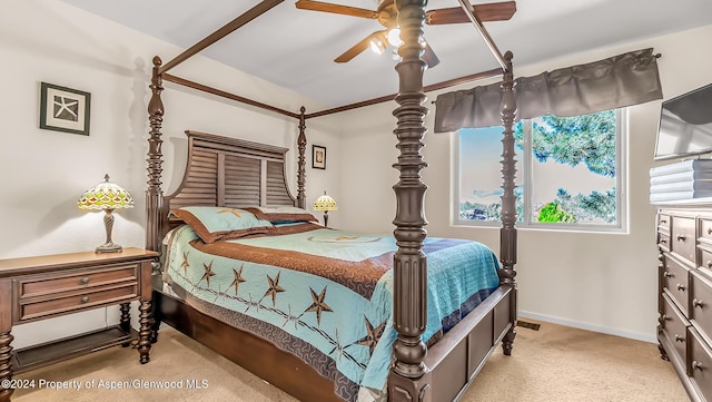 bedroom with ceiling fan and light carpet