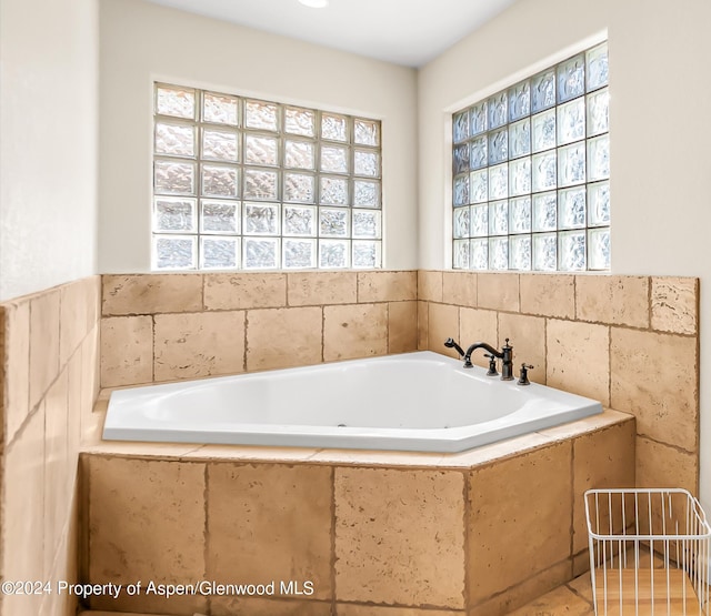 bathroom with tiled bath