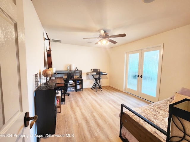 interior space featuring access to exterior, french doors, light wood-type flooring, and ceiling fan