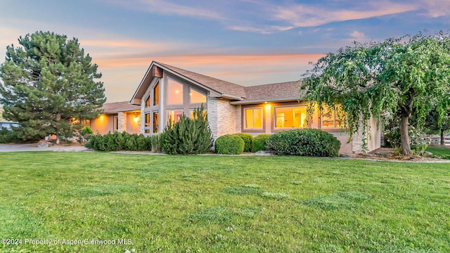 view of front of home with a yard