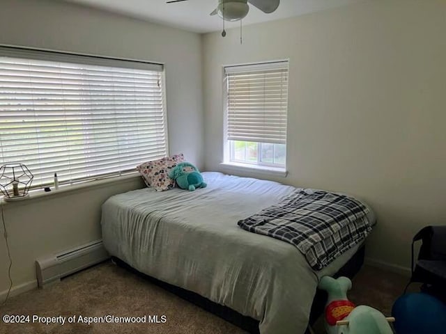 bedroom with ceiling fan, carpet floors, and baseboard heating