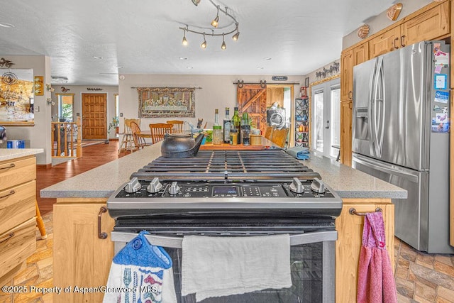 550 County Road 22, Craig, CO 81625 - kitchen with appliances with stainless steel finishes and a kitchen island