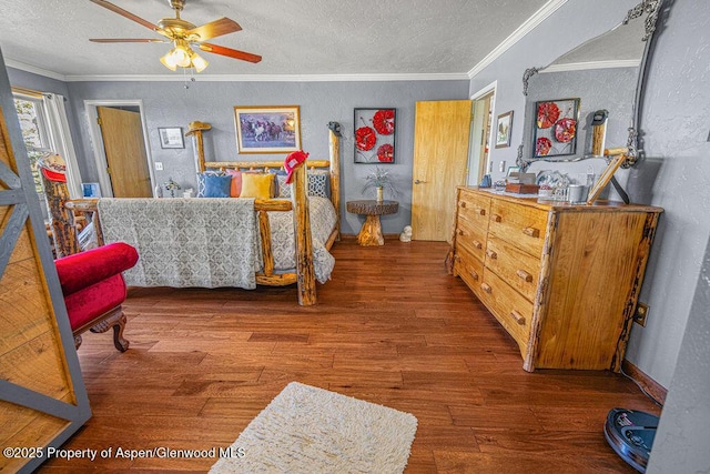 550 County Road 22, Craig, CO 81625 - bedroom with wood finished floors, a textured ceiling, a textured wall, and ornamental molding