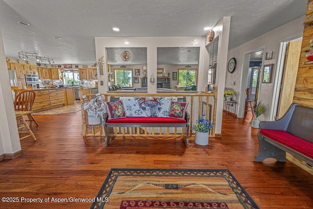 550 County Road 22, Craig, CO 81625 - living area with a textured ceiling, hardwood / wood-style floors, and healthy amount of natural light