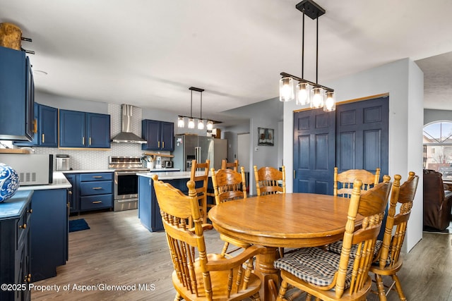 dining space featuring wood finished floors